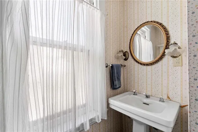 a bathroom with a sink and a mirror