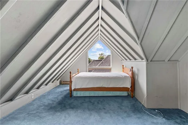 a view of balcony with wooden floor and fence