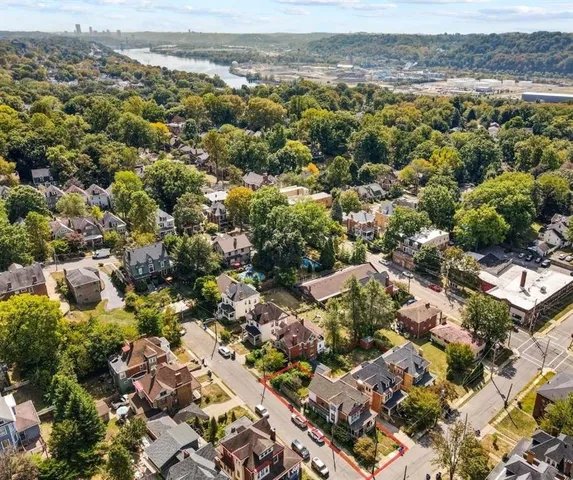 an aerial view of residential houses with outdoor space