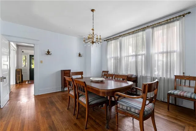 a dining room with furniture window wooden floor