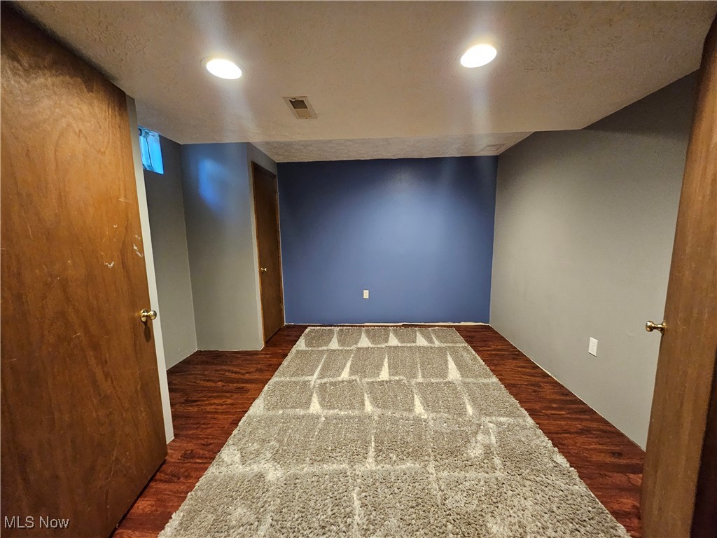 6247 Hathaway Road Cleveland, OH 44125 - Photo 42 of 42 Spare room with recessed lighting and dark wood-type flooring