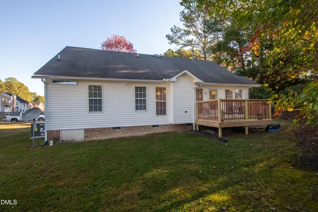 a view of balcony with wooden floor and outdoor seating