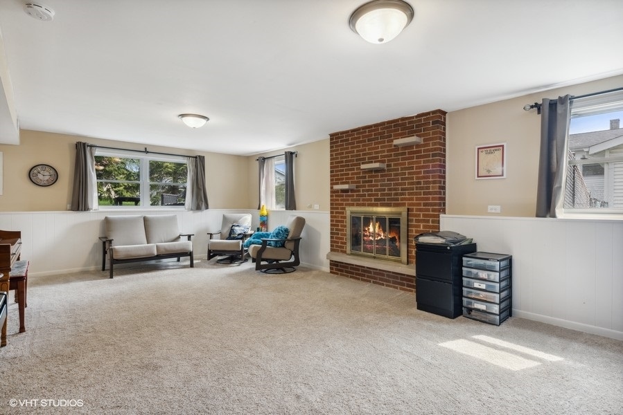 534 71st Street Darien, IL 60561 - Photo 11 of 20 a living room with furniture and a fireplace