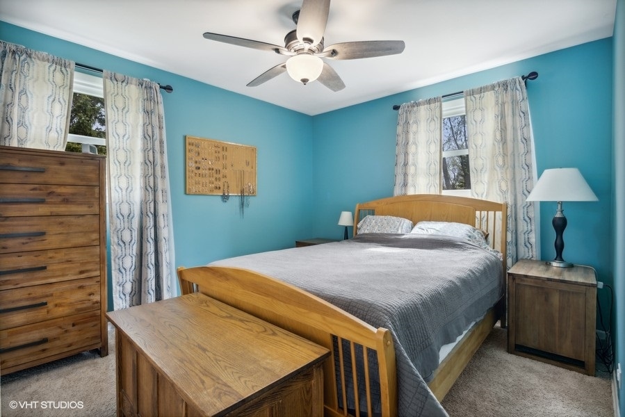 534 71st Street Darien, IL 60561 - Photo 12 of 20 a bedroom with a bed and a table