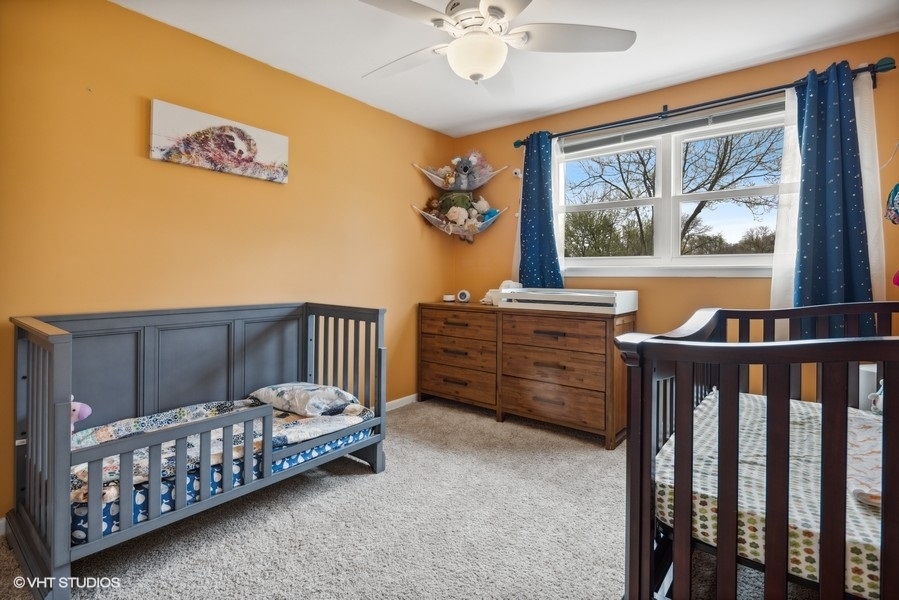 534 71st Street Darien, IL 60561 - Photo 13 of 20 a bedroom with a bed and wooden floor