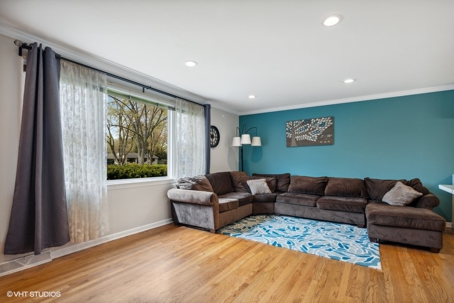 534 71st Street Darien, IL 60561 - Photo 5 of 20 a living room with furniture and a large window