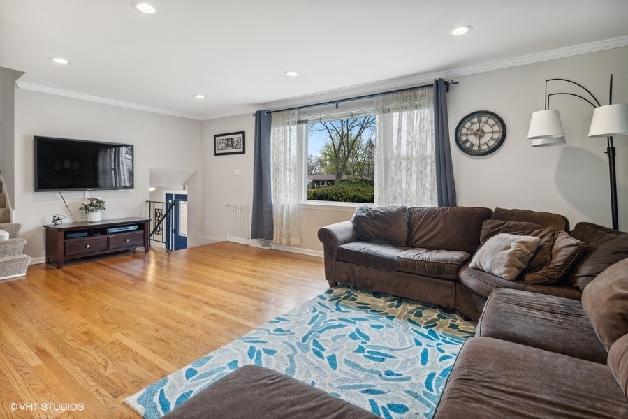 534 71st Street Darien, IL 60561 - Photo 6 of 20 a living room with furniture and a flat screen tv