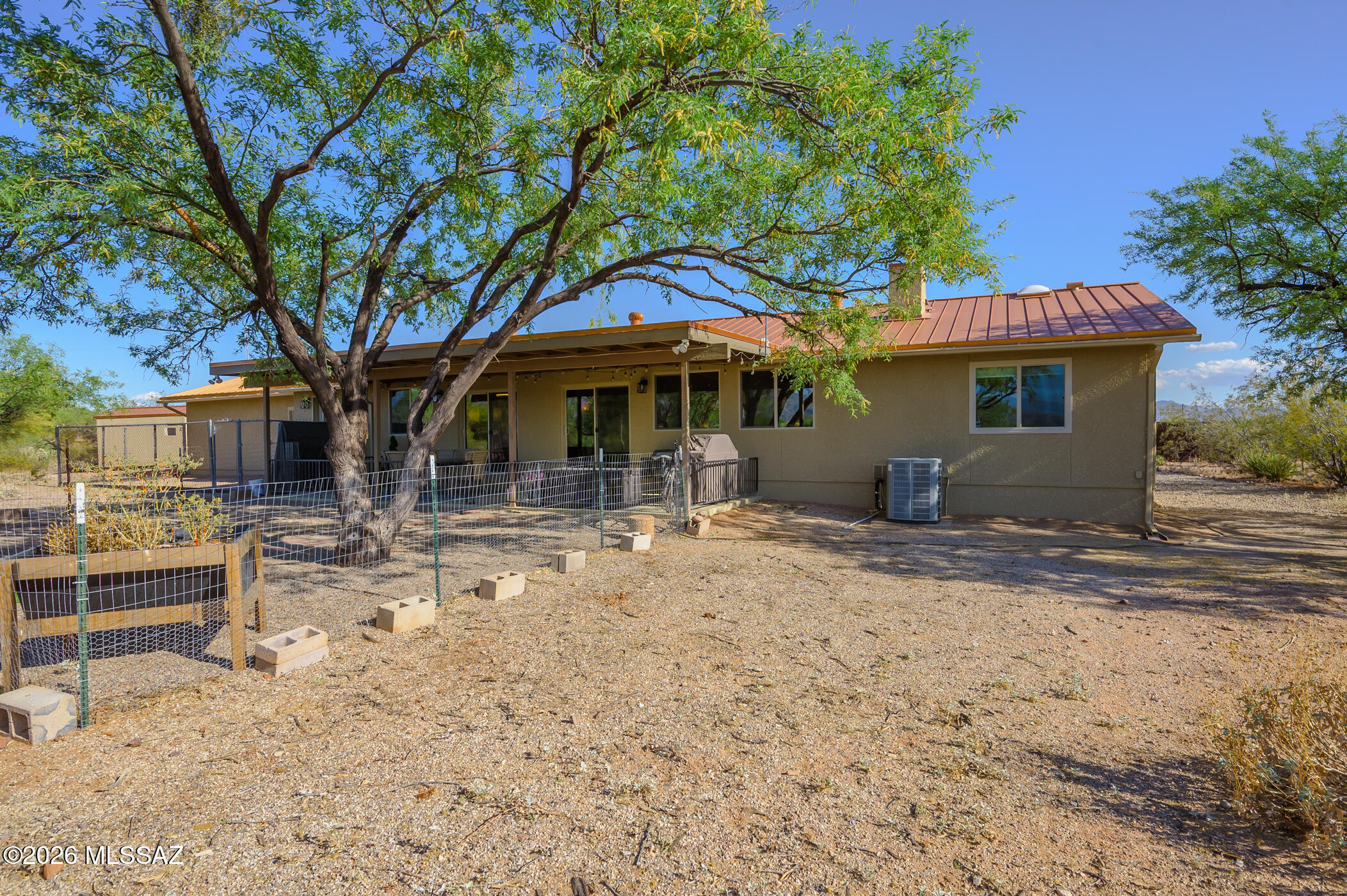 13599 East Rincon Ranch Road Vail, AZ 85641 - Photo 37 of 41 a front view of a house with a yard