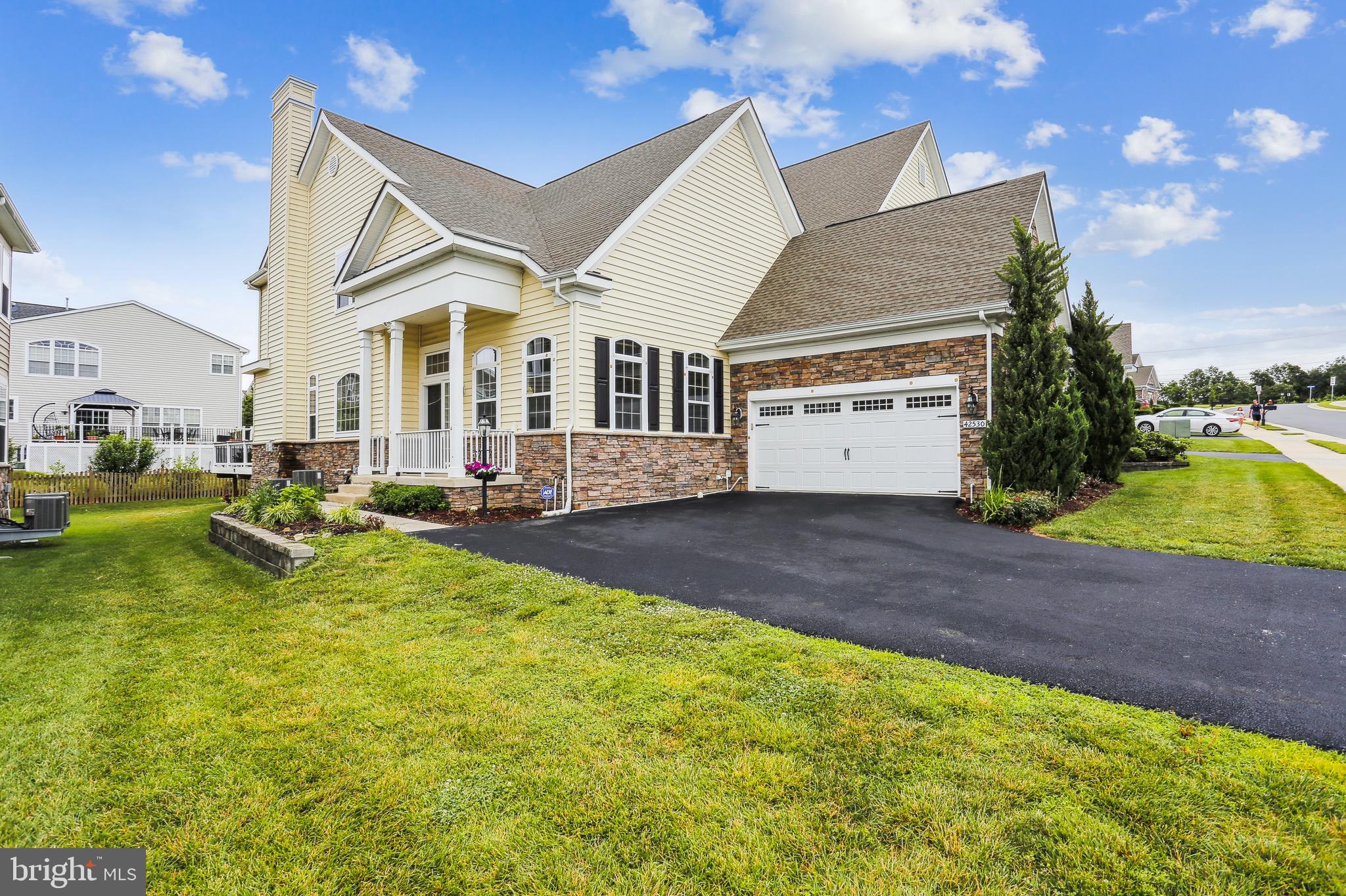 42530 Sungrove Terrace Ashburn, VA 20148 - Photo 1 of 29 a view of a house with swimming pool and sitting area