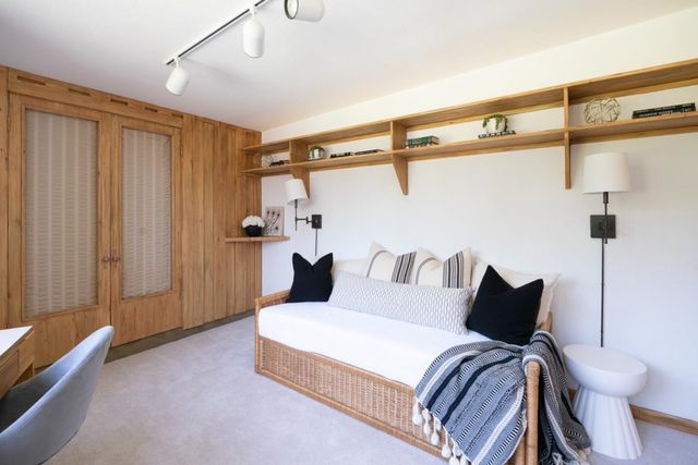 a bedroom with a bed and furniture