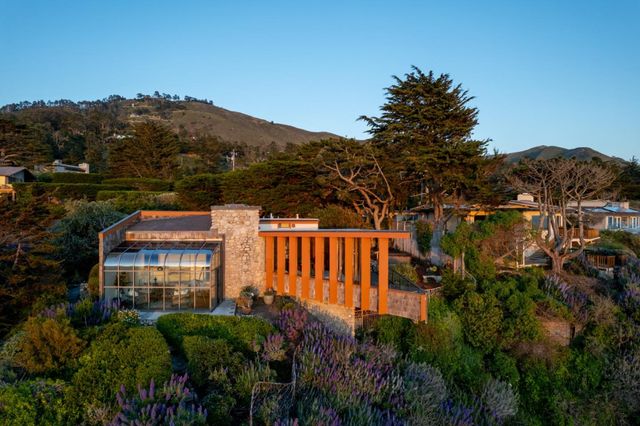 a view of building with a garden