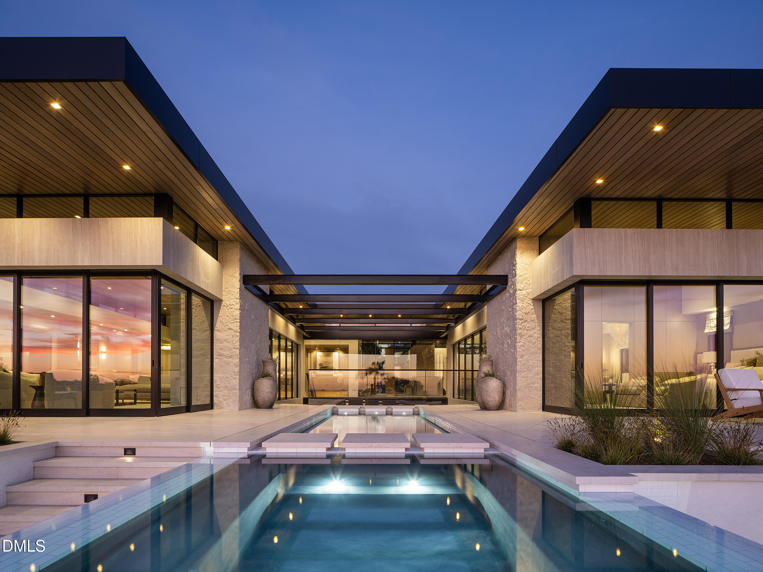 a room with pool table and windows
