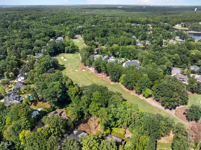 a view of a swimming pool with a yard