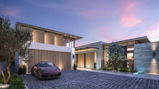 a backyard of a house with barbeque oven and outdoor seating