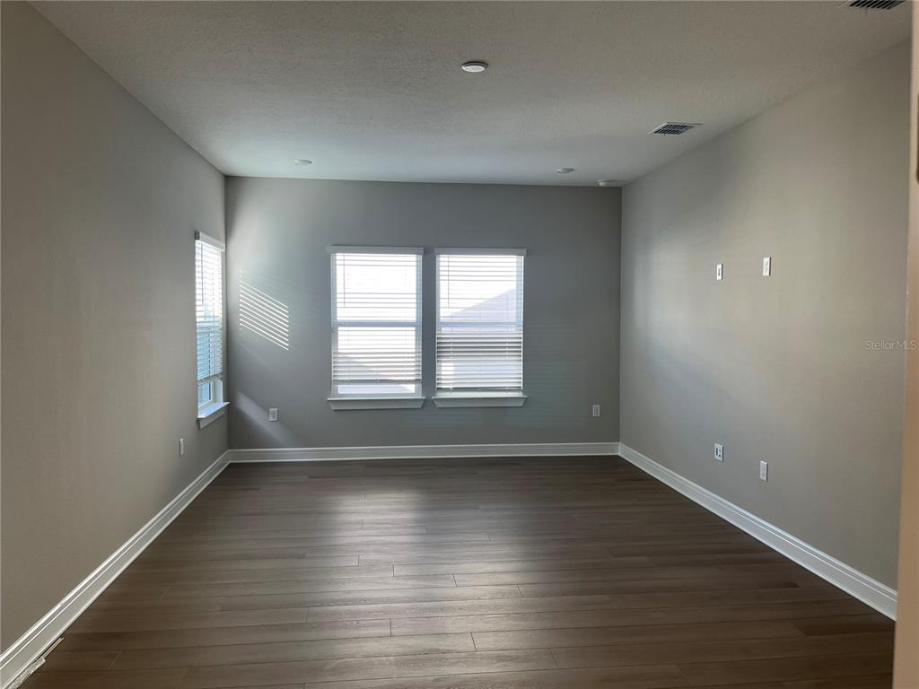3012 Polaris Drive St. Cloud, FL 34771 - Photo 14 of 21 wooden floor in an empty room with a window