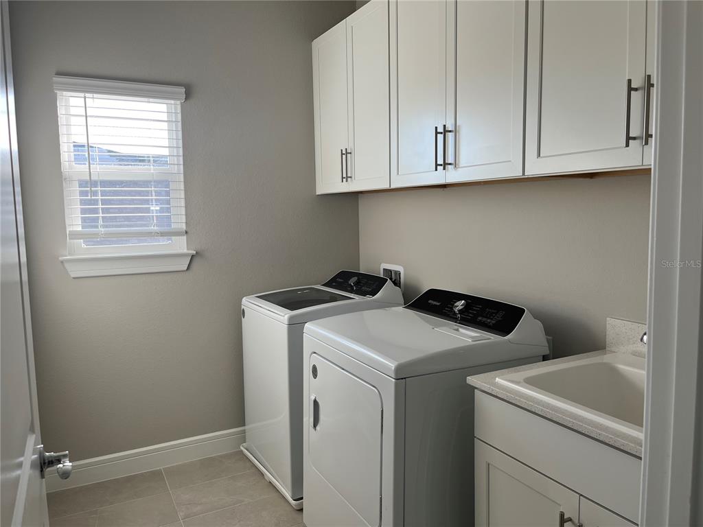 3012 Polaris Drive St. Cloud, FL 34771 - Photo 17 of 21 a utility room with dryer and washer
