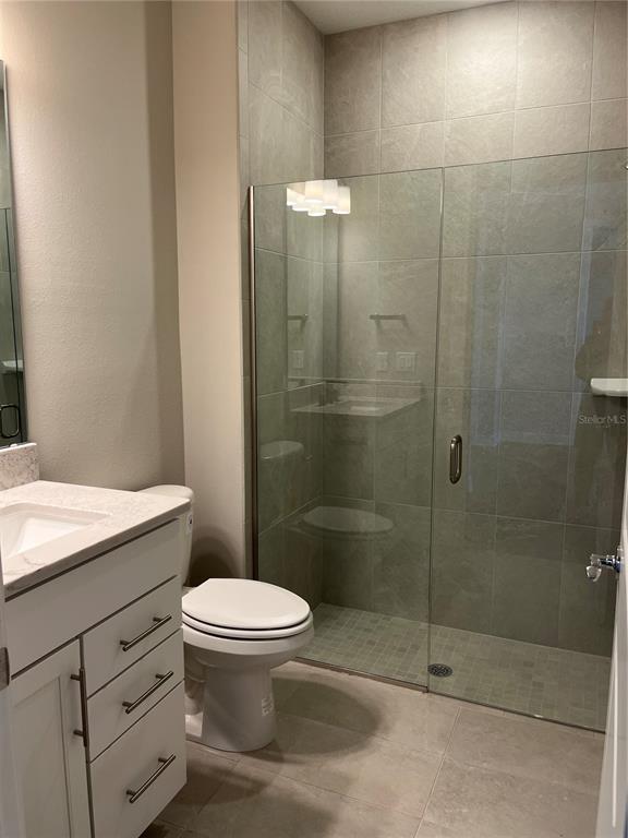 3012 Polaris Drive St. Cloud, FL 34771 - Photo 18 of 21 a bathroom with a toilet and a shower