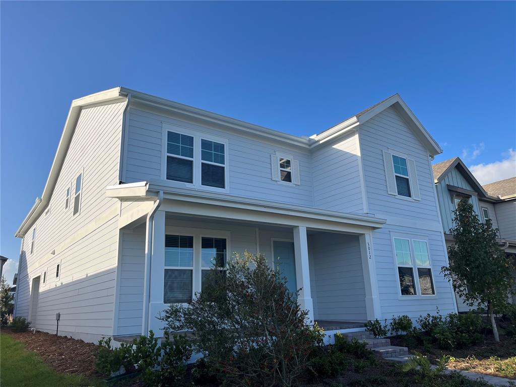 3012 Polaris Drive St. Cloud, FL 34771 - Photo 2 of 21 a front view of a house with a yard