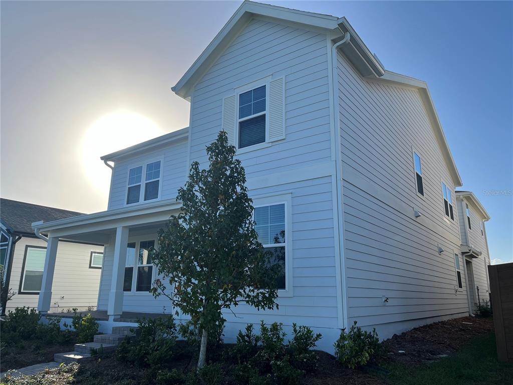 3012 Polaris Drive St. Cloud, FL 34771 - Photo 3 of 21 a front view of a house with plants