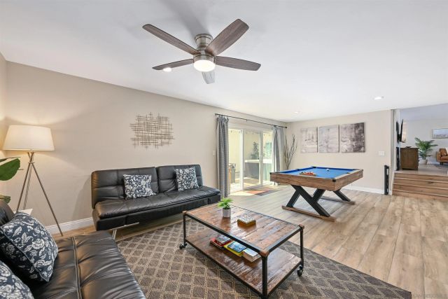a living room with furniture and a rug