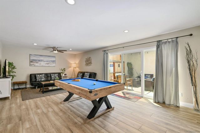 a living room with furniture a rug and a table