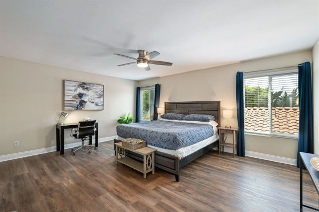 a bedroom with a bed and a table in it