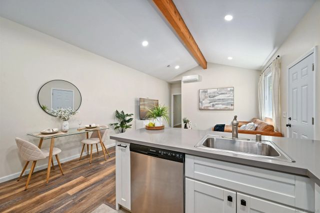 a living room with furniture and a mirror