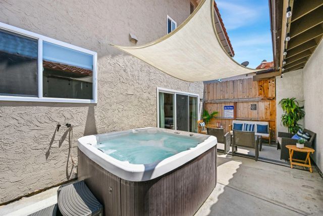 a backyard of a house with outdoor seating