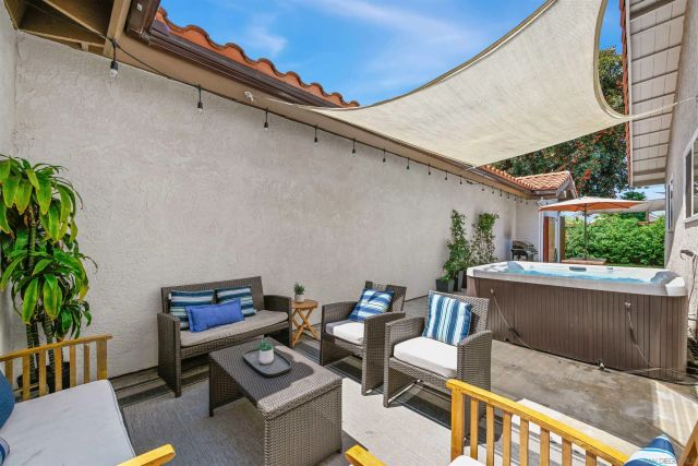 a view of a house with backyard and porch