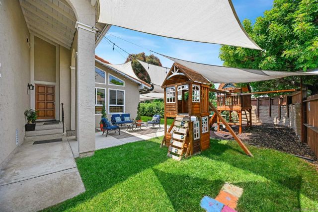 a view of a patio with table and chairs potted plants with wooden floor