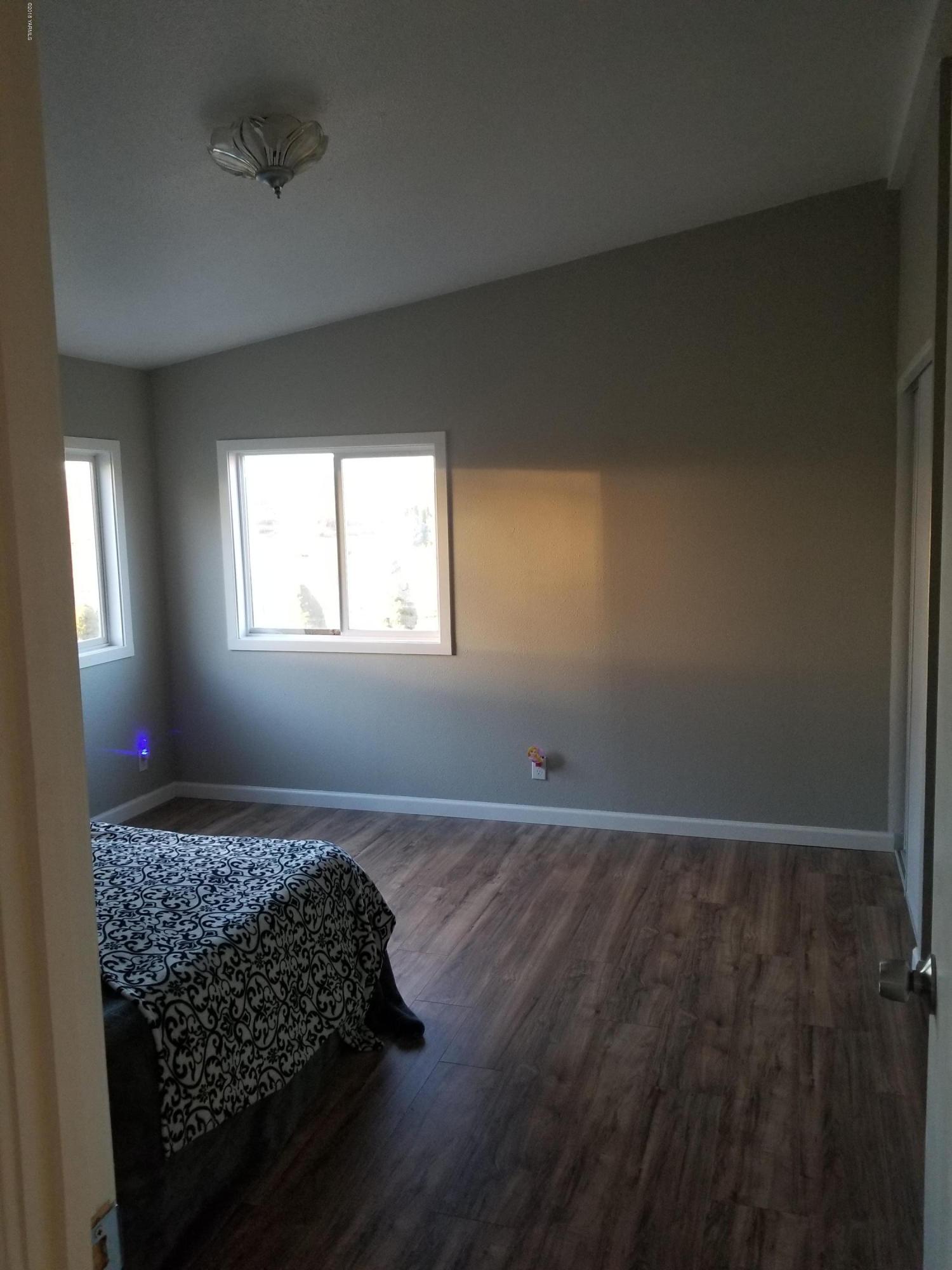1033 Rader Road Sunnyside, WA 98944 - Photo 6 of 12 a living room with hard wood floor and window