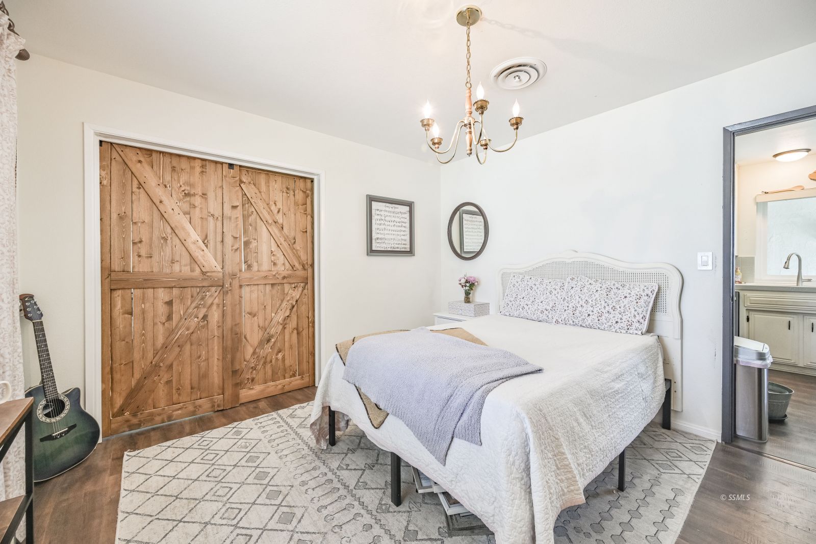 719 Sherri Street Ridgecrest, CA 93555 - Photo 19 of 36 a bedroom with a bed and a mirror
