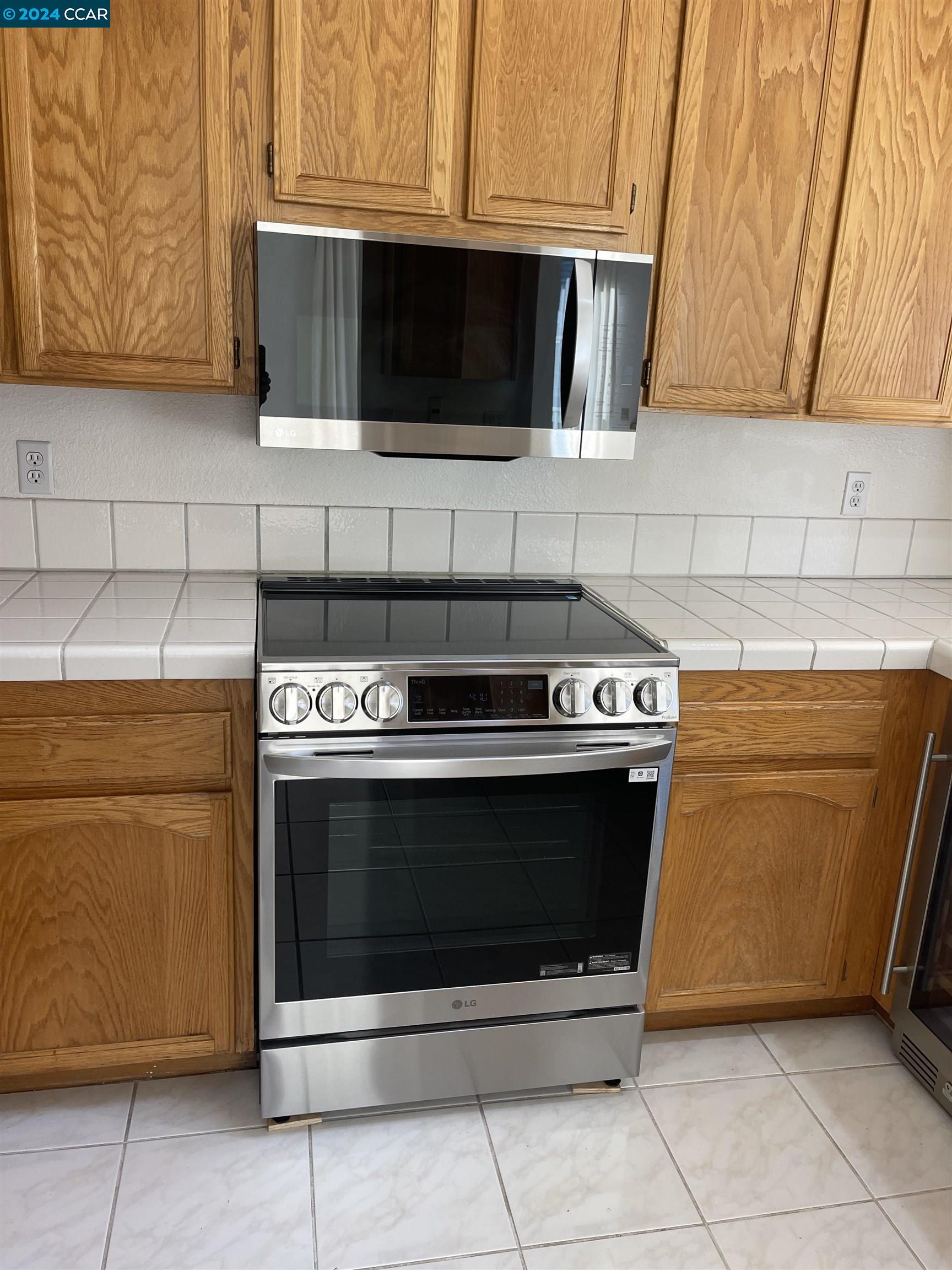 32 Danville Oak Place Danville, CA 94526 - Photo 10 of 11 a stove top oven sitting inside of a kitchen