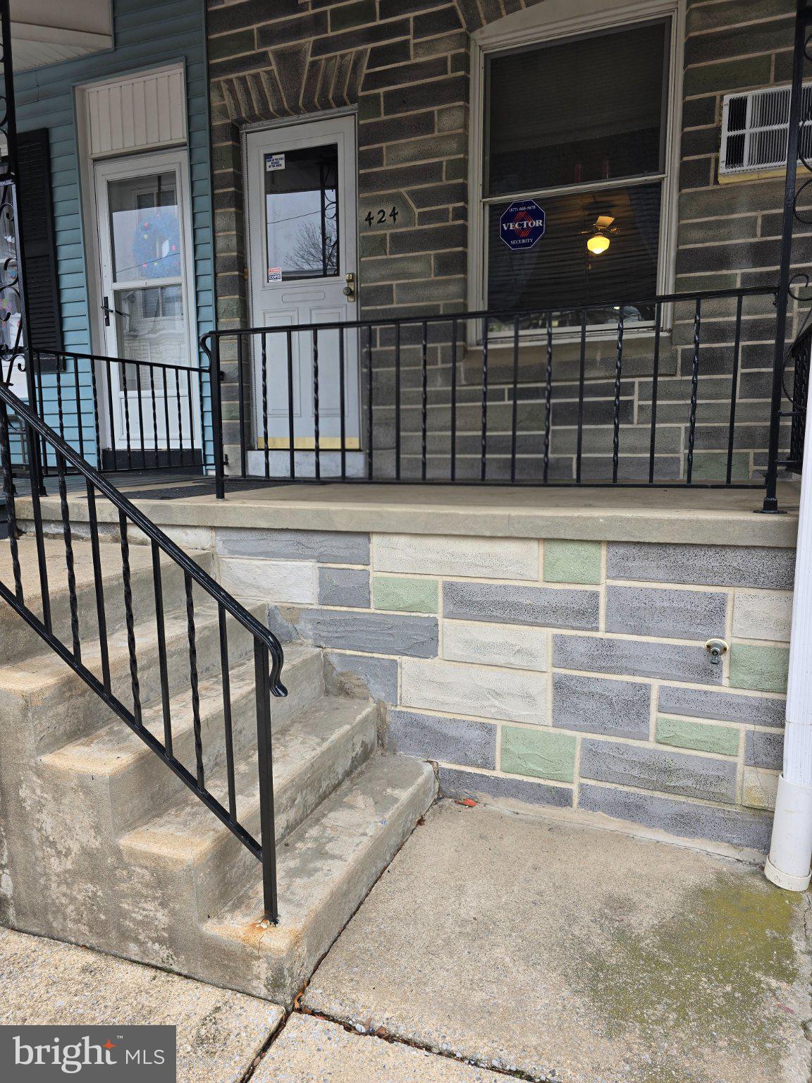 Charming entryway with stone accents.