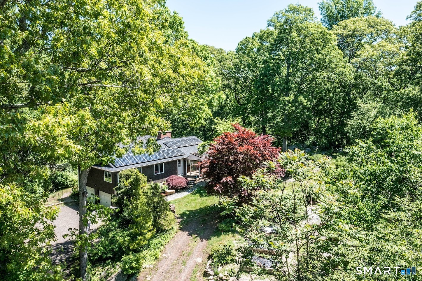 Hidden among the trees, surrounded by six acres of possibility.