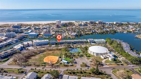 an aerial view of a house with a lake view