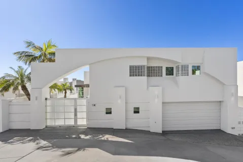 a front view of a house with a garage