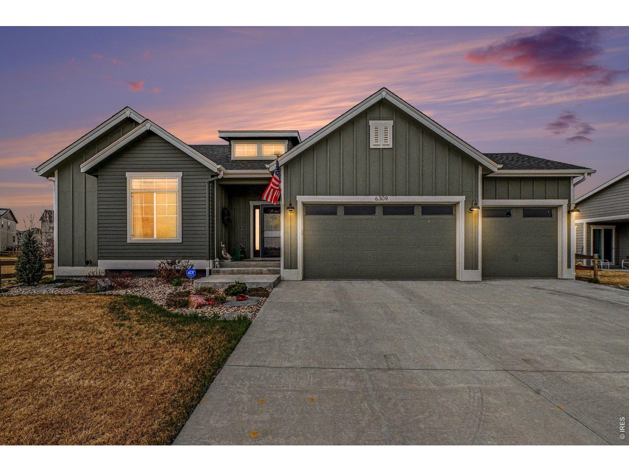 6309 2nd Street Greeley, CO 80634 - Photo 1 of 33 a front view of a house with yard and garage