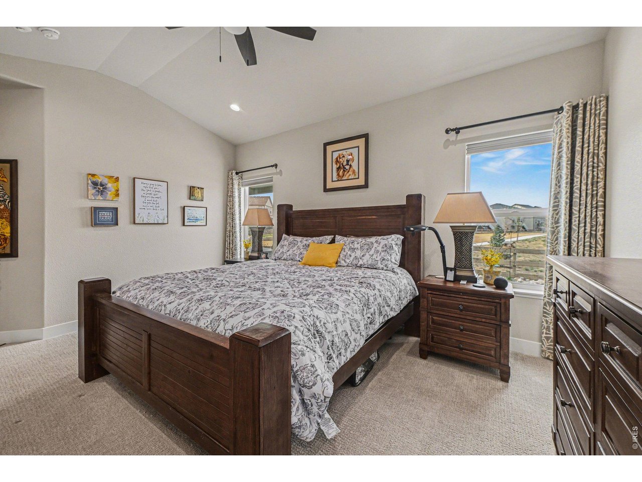 6309 2nd Street Greeley, CO 80634 - Photo 11 of 33 a bedroom with a large bed and a dresser