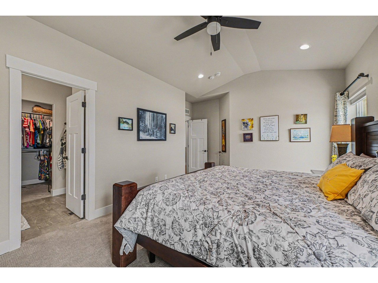 6309 2nd Street Greeley, CO 80634 - Photo 12 of 33 a bedroom with a bed and a flat screen tv
