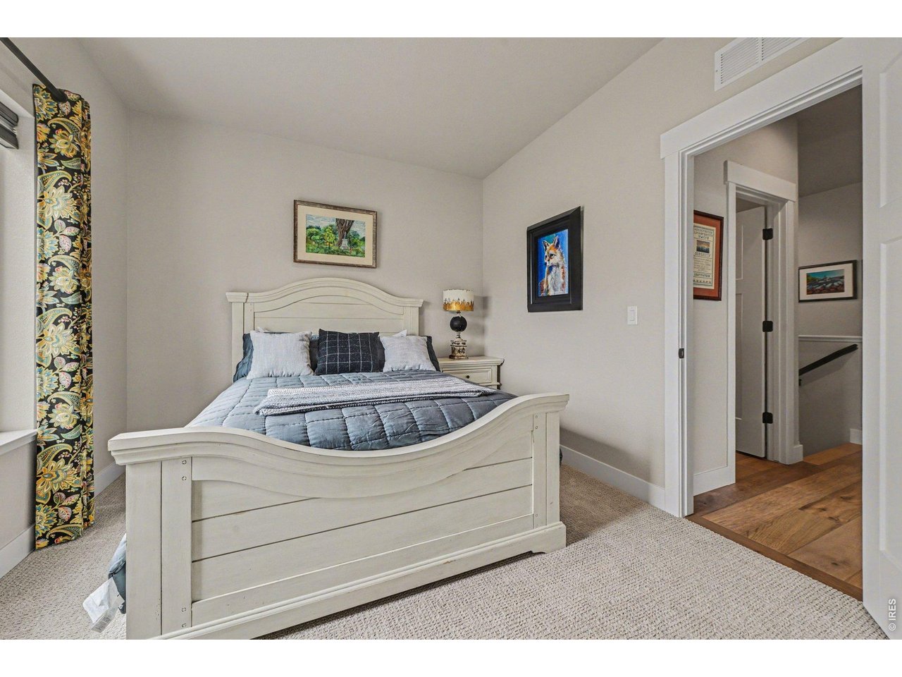 6309 2nd Street Greeley, CO 80634 - Photo 14 of 33 a bedroom with a bed and a painting on the wall