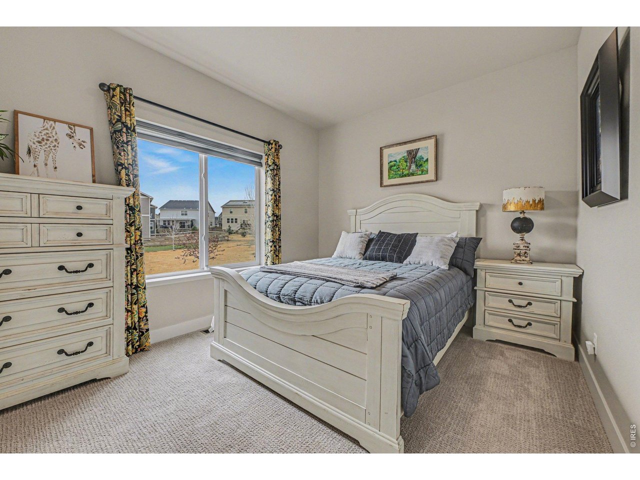 6309 2nd Street Greeley, CO 80634 - Photo 15 of 33 a bedroom with a bed and a window