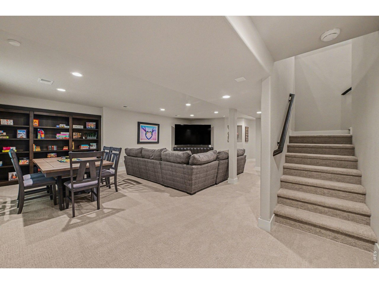 6309 2nd Street Greeley, CO 80634 - Photo 18 of 33 a living room with furniture and a flat screen tv