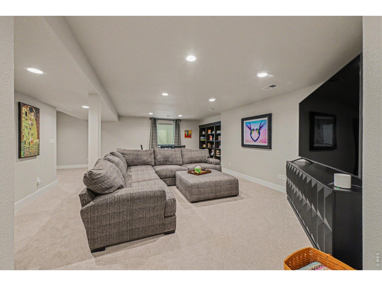 6309 2nd Street Greeley, CO 80634 - Photo 19 of 33 a living room with furniture and a flat screen tv