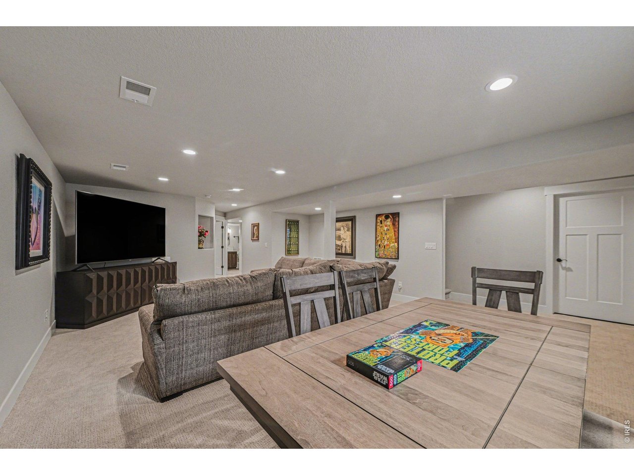 6309 2nd Street Greeley, CO 80634 - Photo 20 of 33 a living room with furniture and a flat screen tv