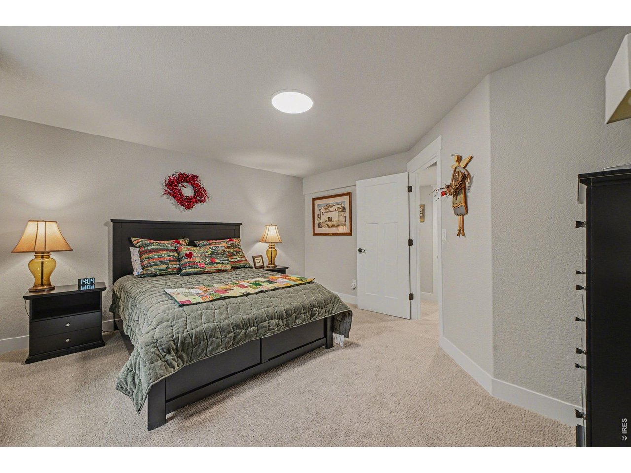 6309 2nd Street Greeley, CO 80634 - Photo 23 of 33 a bedroom with a bed and a window