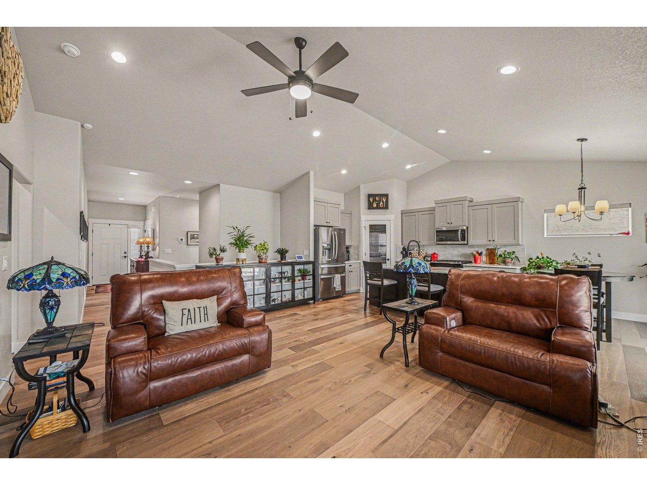 6309 2nd Street Greeley, CO 80634 - Photo 6 of 33 a living room with furniture and kitchen view