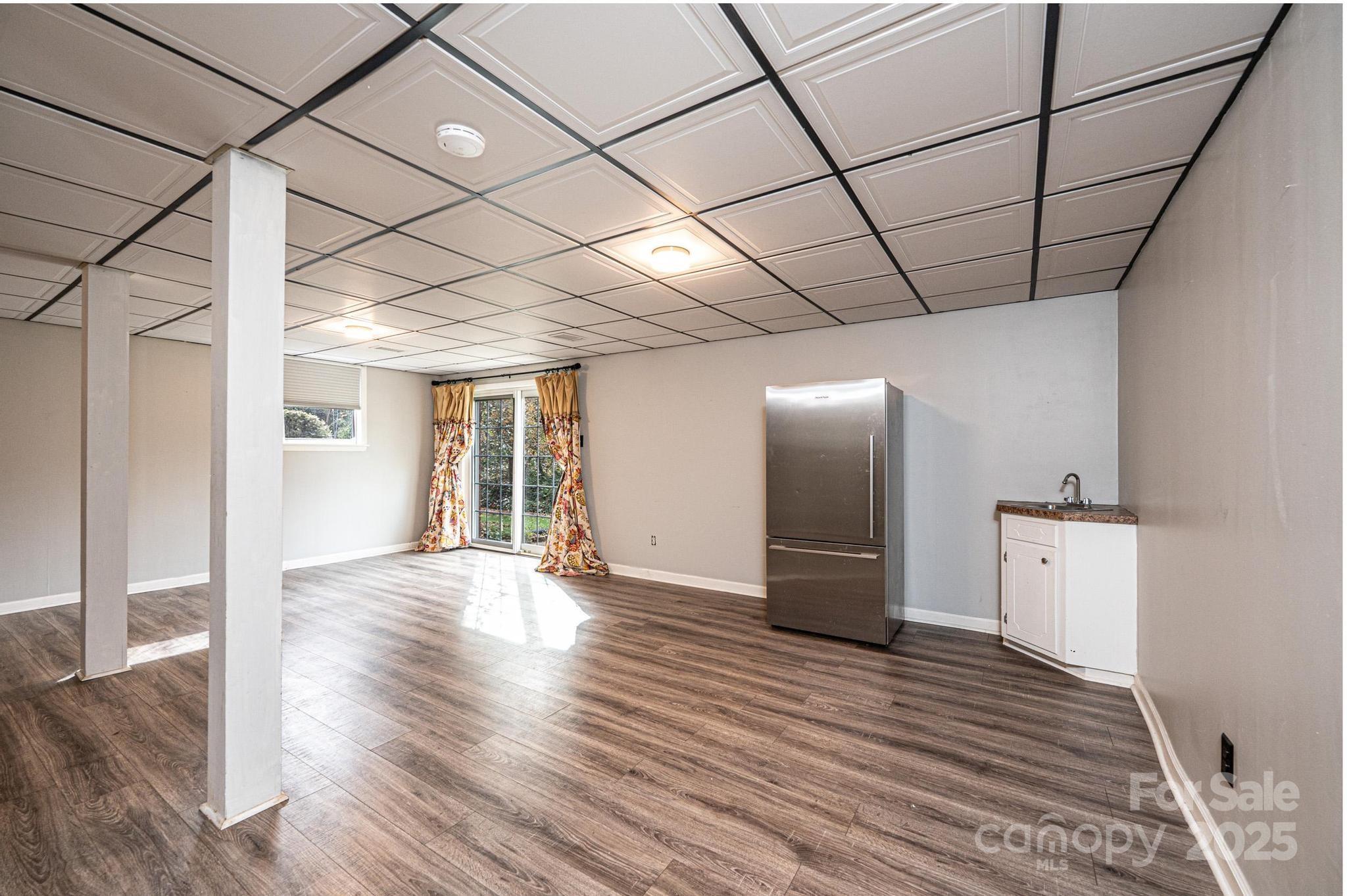 710 4th Avenue Northeast Conover, NC 28613 - Photo 22 of 33 a view of an empty room with wooden floor and a window