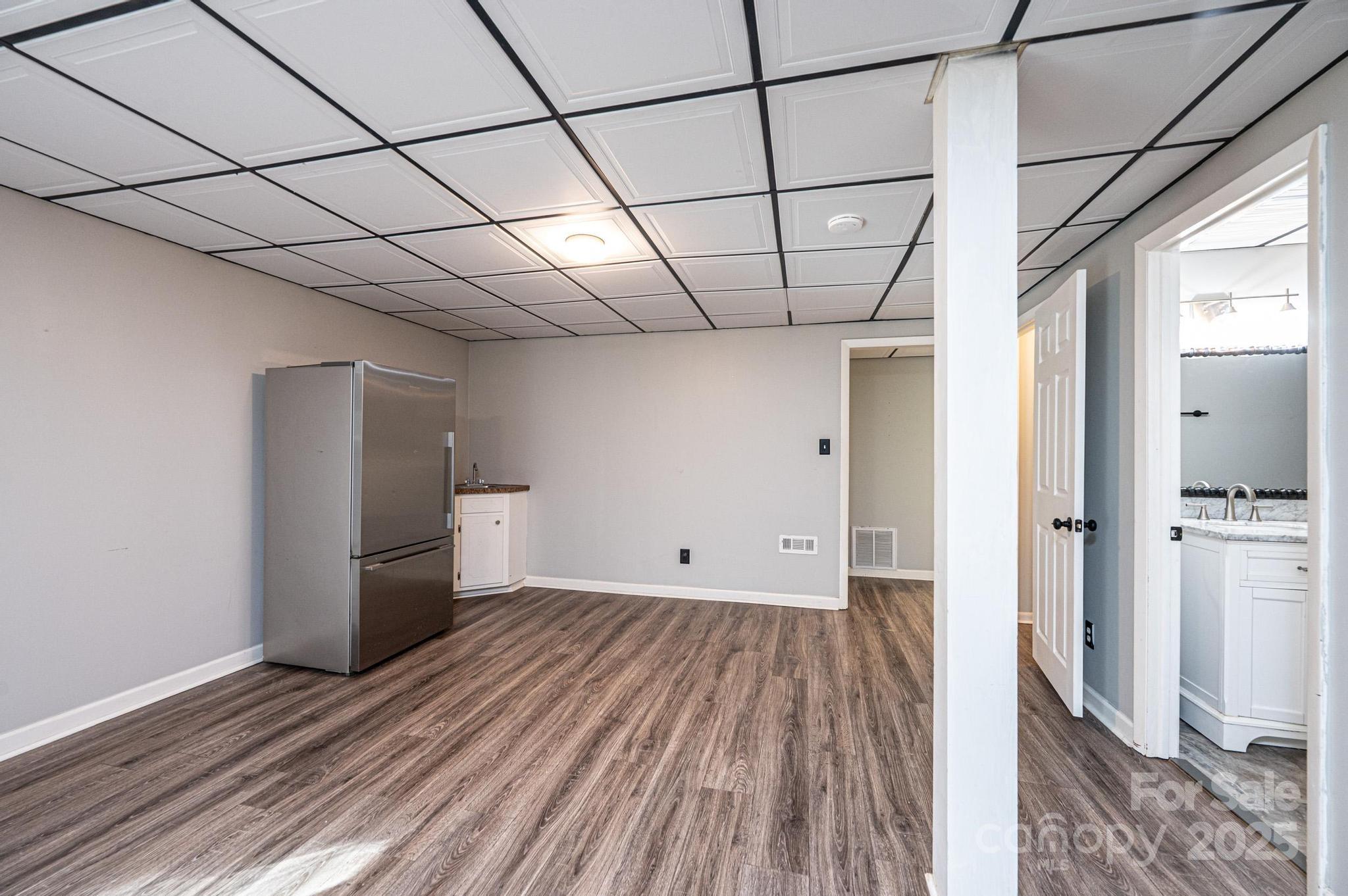 710 4th Avenue Northeast Conover, NC 28613 - Photo 23 of 33 a view of empty room with wooden floor and electronic appliances
