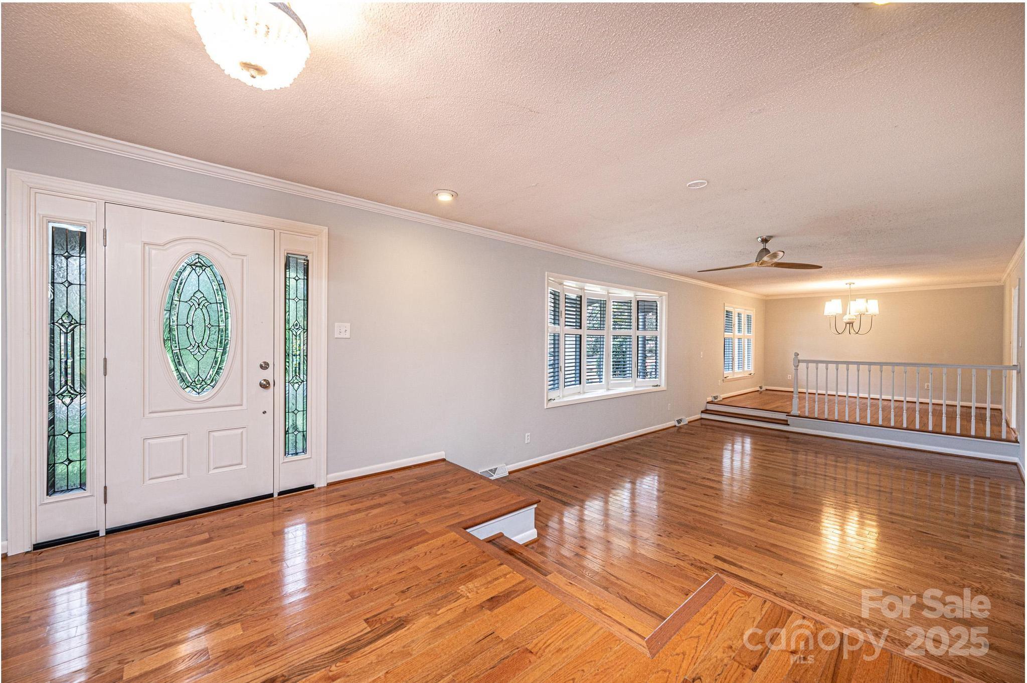 710 4th Avenue Northeast Conover, NC 28613 - Photo 4 of 33 a view of an empty room with wooden floor and a window